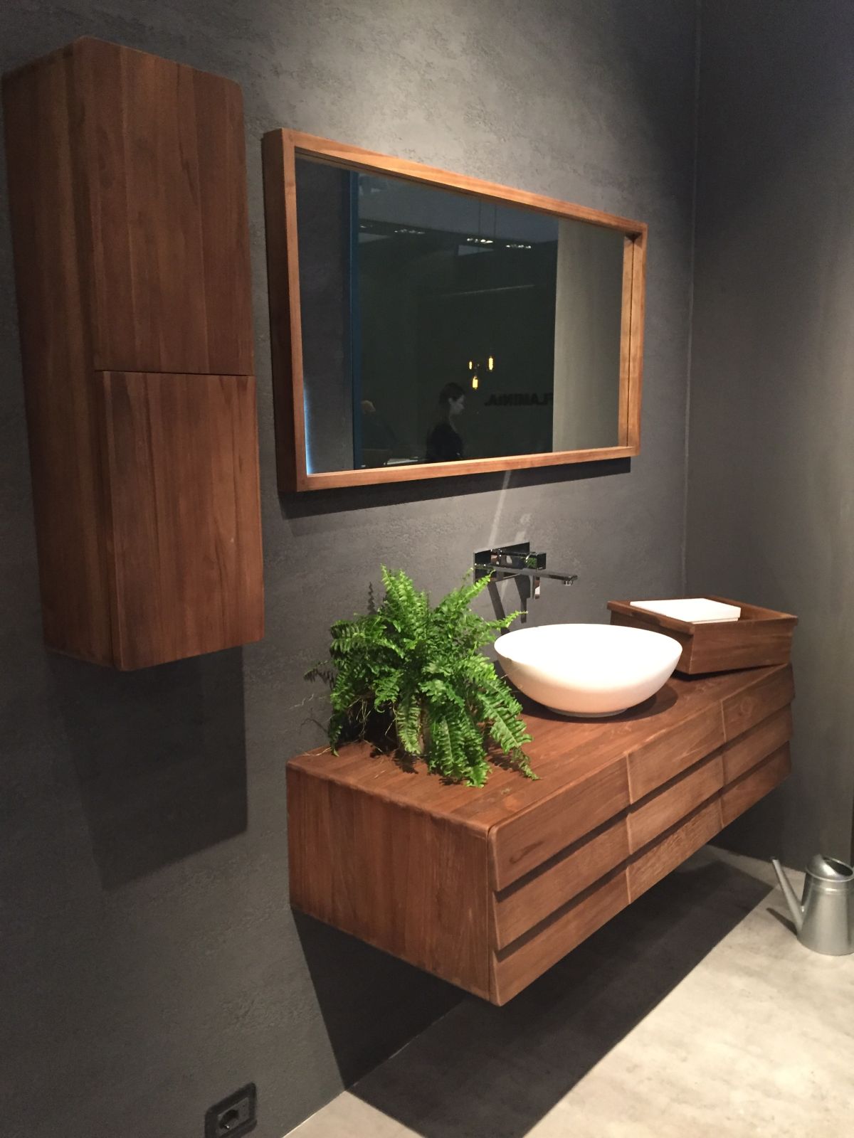 Floating wood vanity with a mid century flair