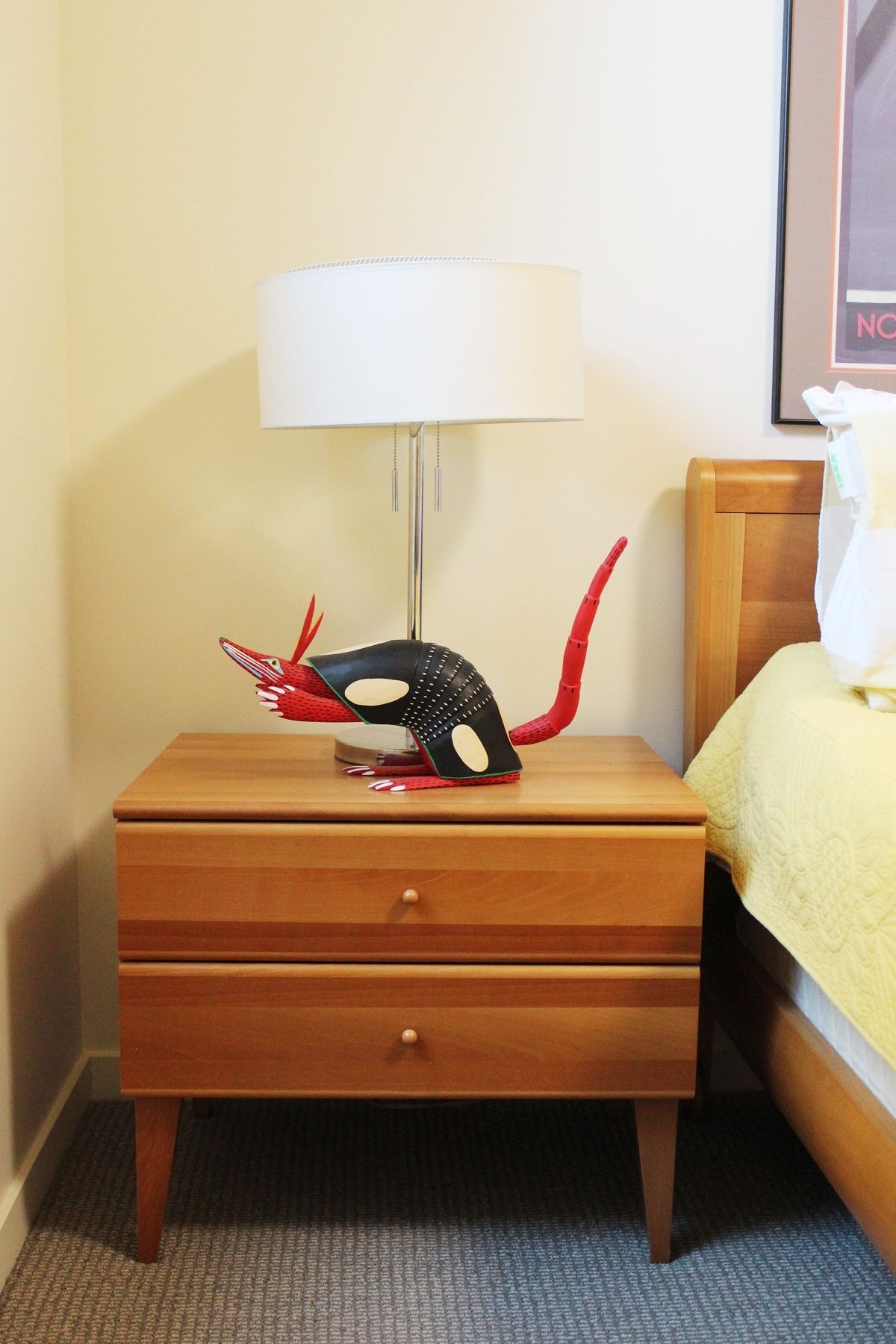 How to decorate a bedroom - nightstand houses an oversized animal