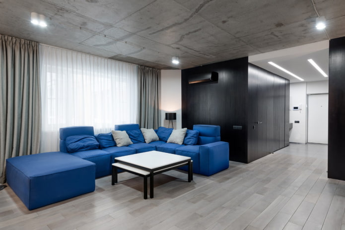 модульный диван синего цвета в интерьере