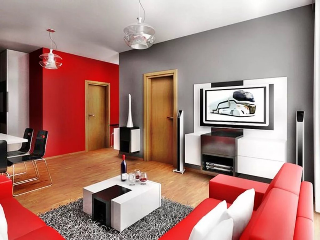 Красный диван в комнате с серой стеной