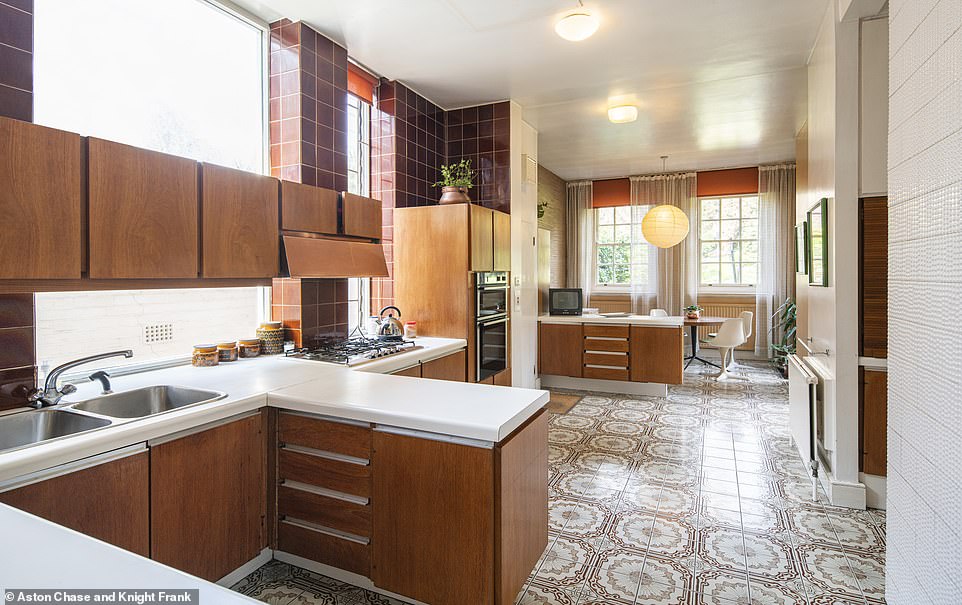 There is a large family kitchen (pictured) decorated in a retro Seventies style, which could easily be modernised