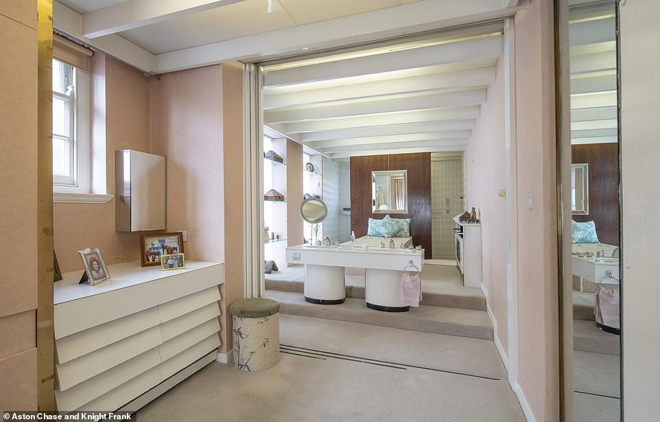 The generous en suite bathroom off the master bedroom boasts a freestanding bath and walk-in shower